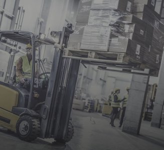 yellow-forklift-moving-stack-of-boxes-in-lean-production