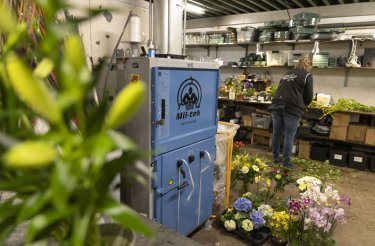 a102-blue-pneumatic-baler-standing-in-flower-shop