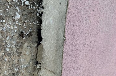 close up of EPS6 in cladding behind a pink wall