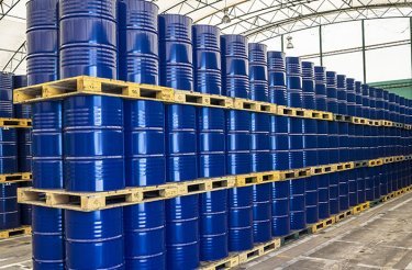 Blue industrial drums stacked in 3 layers