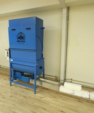blue compactor for polystyrene on wood floor