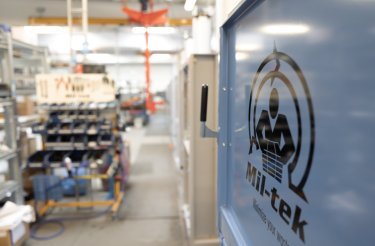 baler door close up with mil-tek logo
